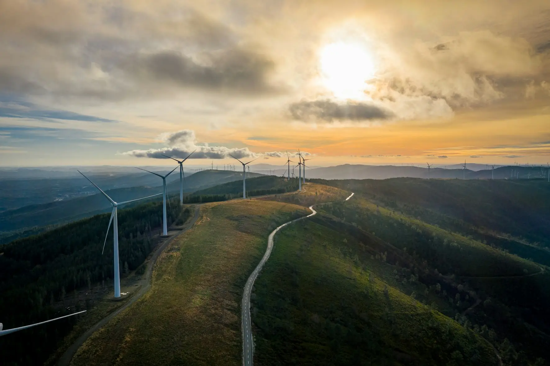 Wind turbines on a ridge at sunset